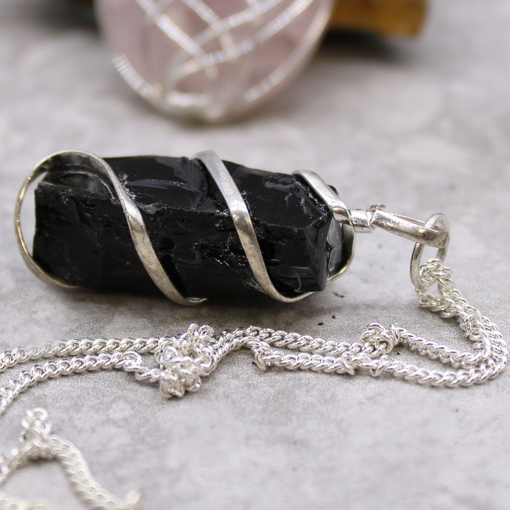 RAW BLACK ONYX WRAPPED CRYSTAL PENDANT NECKLACE